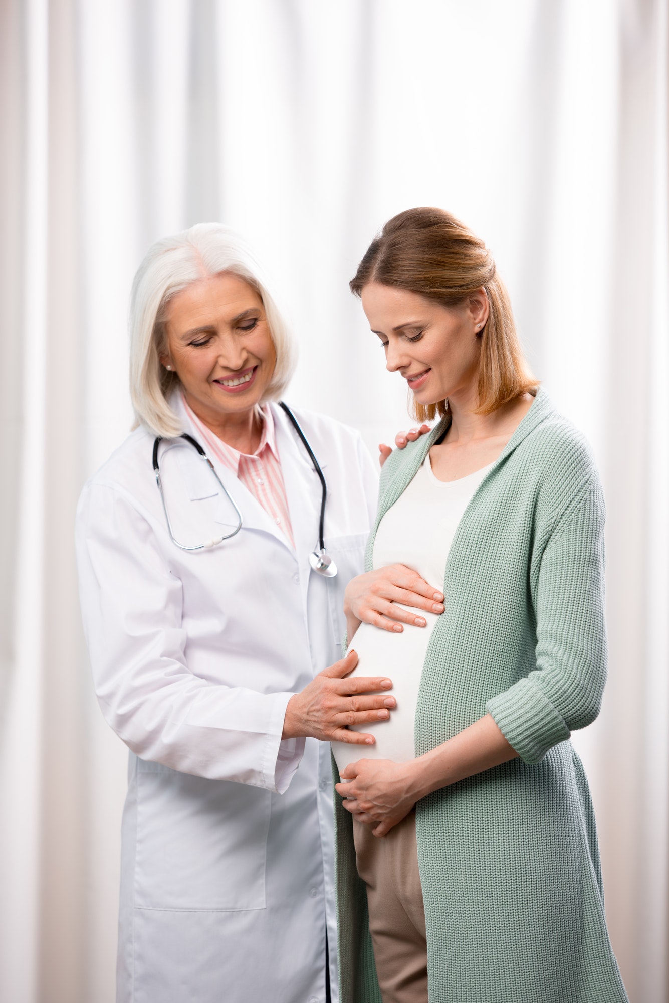 doctor-examining-young-pregnant-woman-during-medical-consultation.jpg doctor-examining-young-pregnant-woman-during-medical-consultation.jpg
